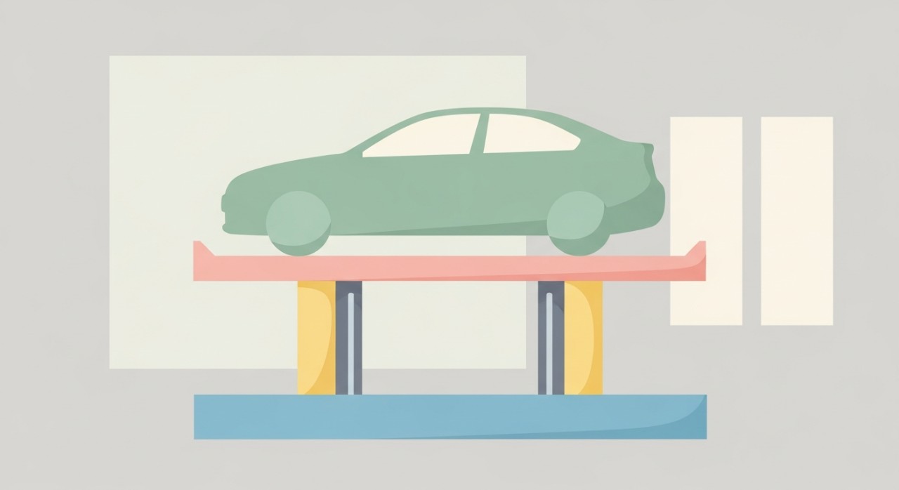 Sebuah kereta sedang diangkat di atas lif hidraulik untuk pemeriksaan atau pembaikan bahagian bawah.